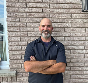 image of a website home page header, with an inspector wearing a black t-shirt