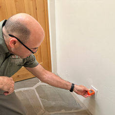Inspector Peter Inspecting checking outlet using tester