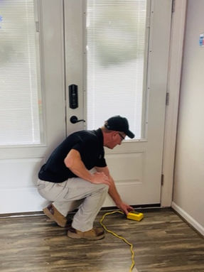 Inspector Howard Inspecting at a door