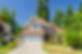 brown-roof-white-garage-house