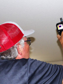 Inspector William Inspecting house using a thermal