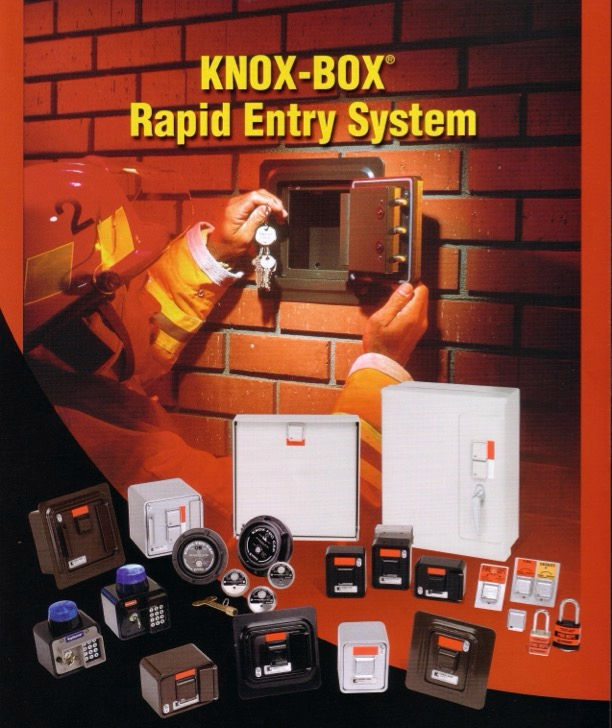 A firefighter opens a Knox Box