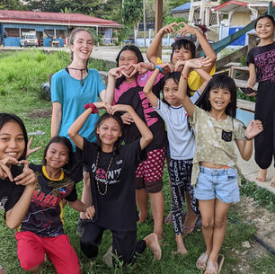 Cicely with some of the children she worked with in Borneo.