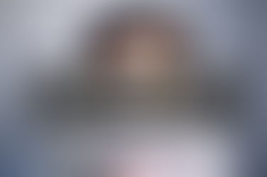 Person with sunglasses holding fanned-out $100 bills. Text overlay: "Passive Earning from Digital Products What the reels don't tell you." Neutral background.