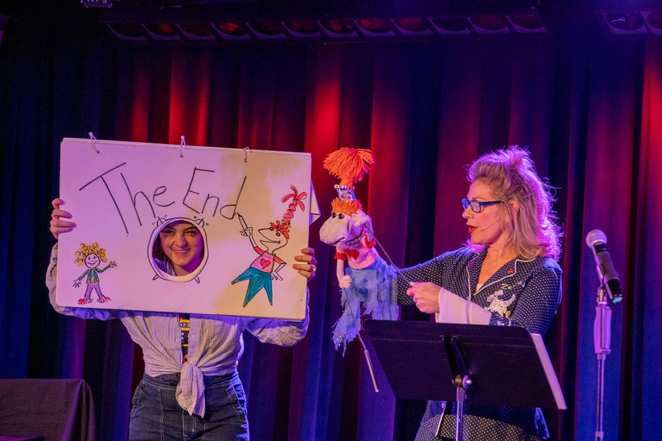 Leslie, Lolly and audience participant on stage