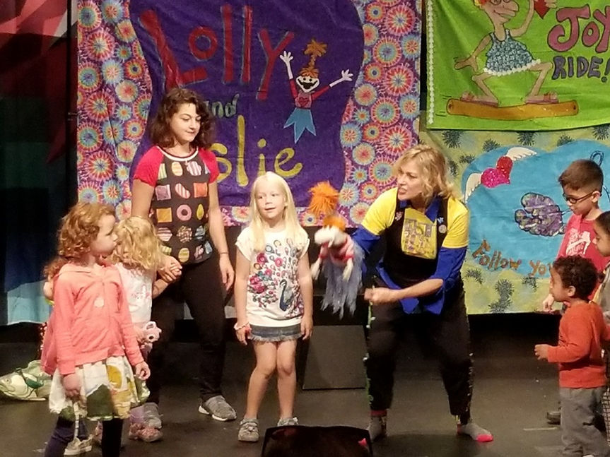 Leslie, Lolly and children on stage