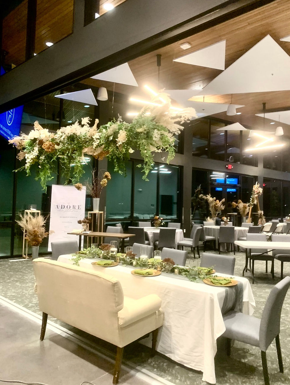 Hanging floral installation by Adore and available for rent as part of the Adore decor collection . Another way couples are saving money on weddings and anyone planning events is by renting what they would have bought .