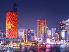 Panoramic night view of Bach Dang River and Ho Chi Minh City’s District 1 skyline, representing Vietnam’s rapid urban development and growing consumer economy.