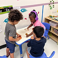 Children playing in learning stations
