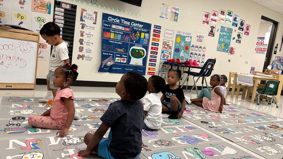 Eye-level view of a colorful preschool classroom with child-friendly furniture and learning materials