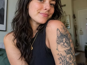 a woman with a cat tattoo