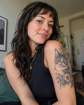 a woman with a cat tattoo