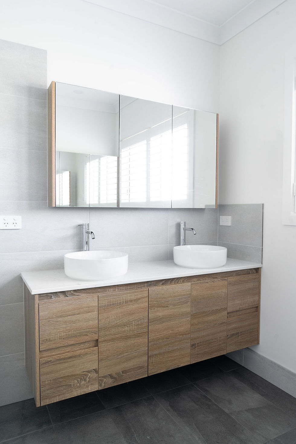 Eye-level view of a beautifully tiled bathroom with neutral tones