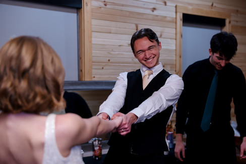 Bride and groom cutting hair before reception