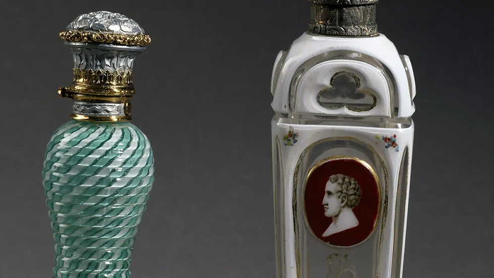 Perfume bottle in filigree milk glass on the left, manufactured by Clichy, on the right Dwerlay glass from Charles X period. France, 19th century. De Agostini via Getty Images