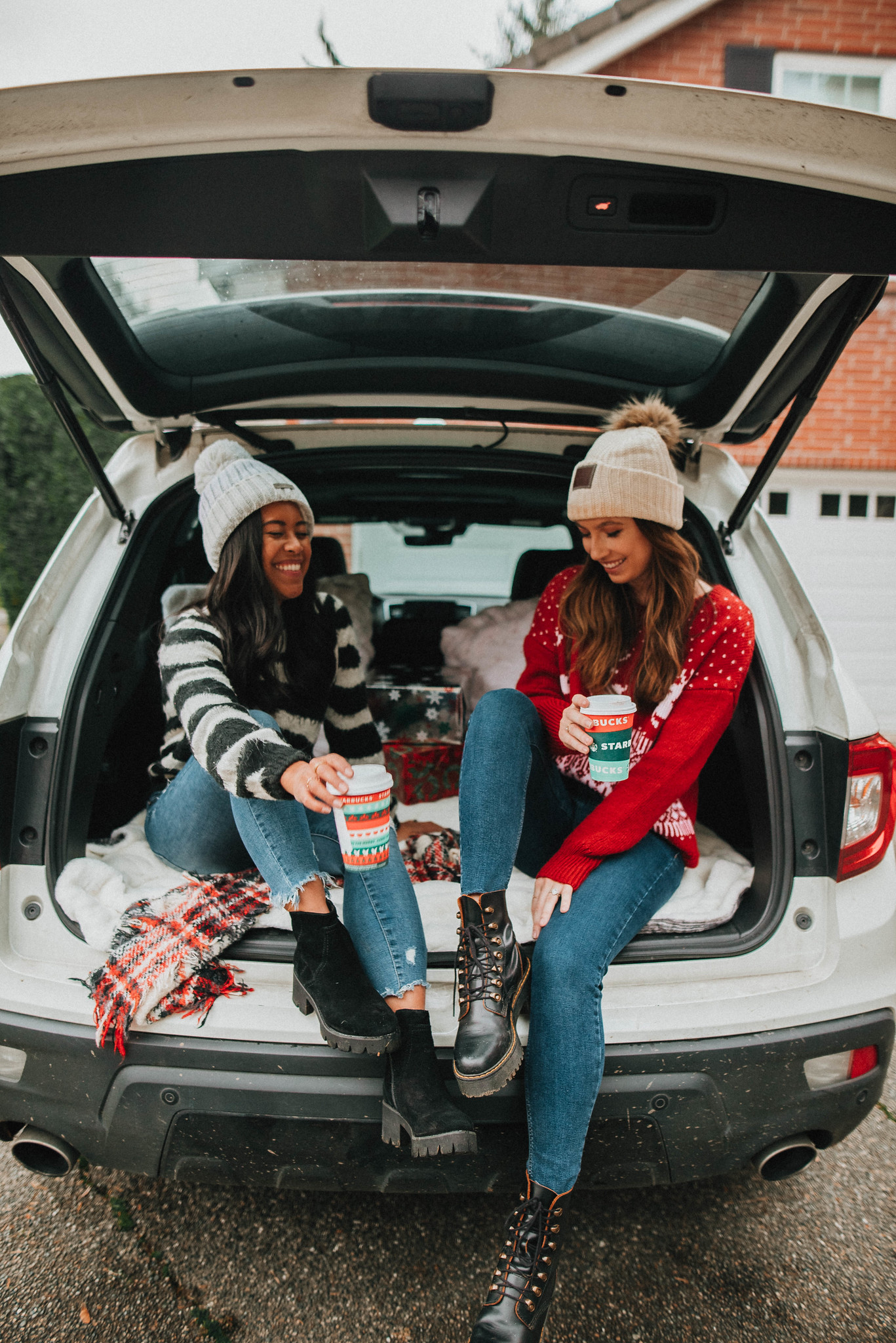 Sitting in the back of the SUV with your best friend - best friend holiday photo shoot ideas - Emma's Edition - image from www.emmasedition.com