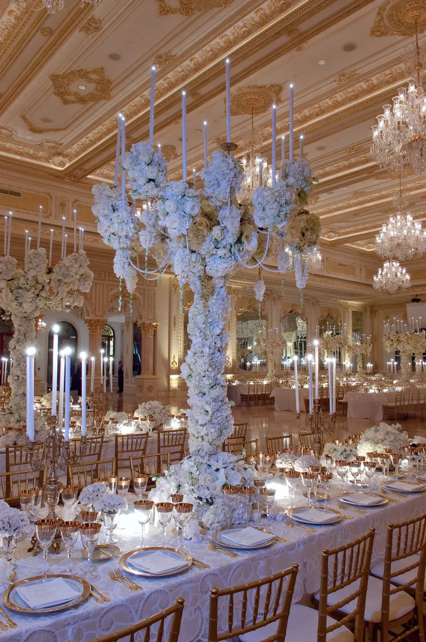 White roses, gardenias and hydrangeas covered the 9-foot candelabras on the dinner tables at the 2005 wedding. Photo Courtesy Preston Bailey