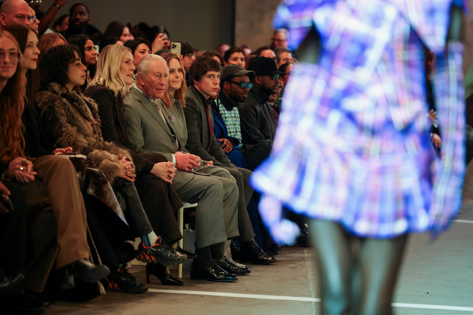 Britain's King Charles and fashion designer Stella McCartney sit on the front row to watch British/Nigerian fashion designer Tolu Coker's AW26 catwalk show on the opening day of London Fashion Week, in London, Britain, February 19, 2026. REUTERS/Isabel Infantes