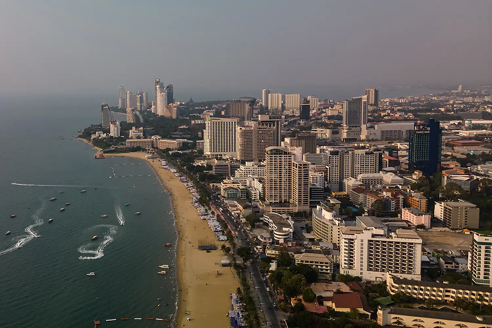 Buildings beyond a beach in Pattaya, Thailand. Andre Malerba/Bloomberg via Getty