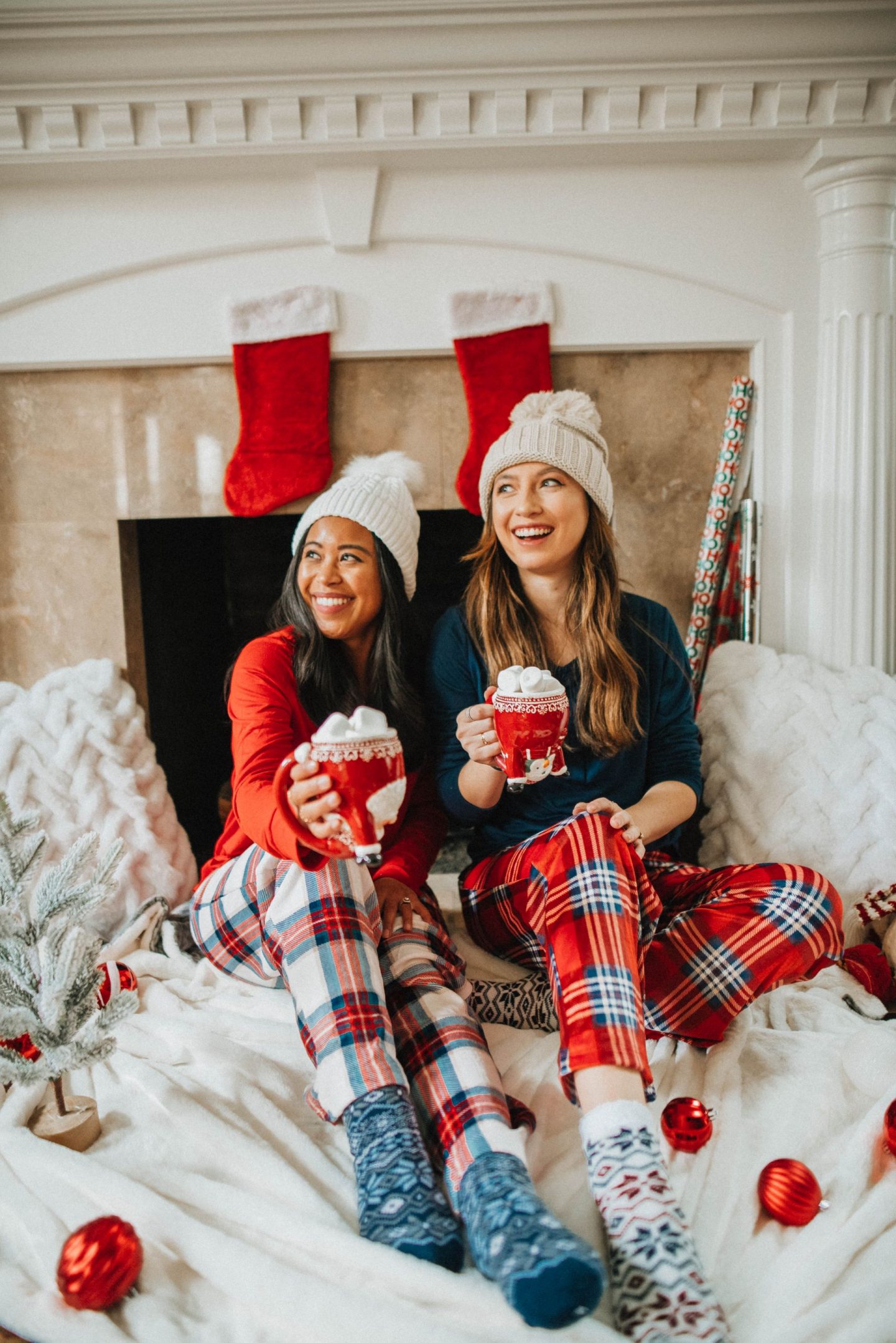 sitting in front of the fire place for holiday photos - christmas pajamas - image from www.emmasedition.com - copyright @emmasedition