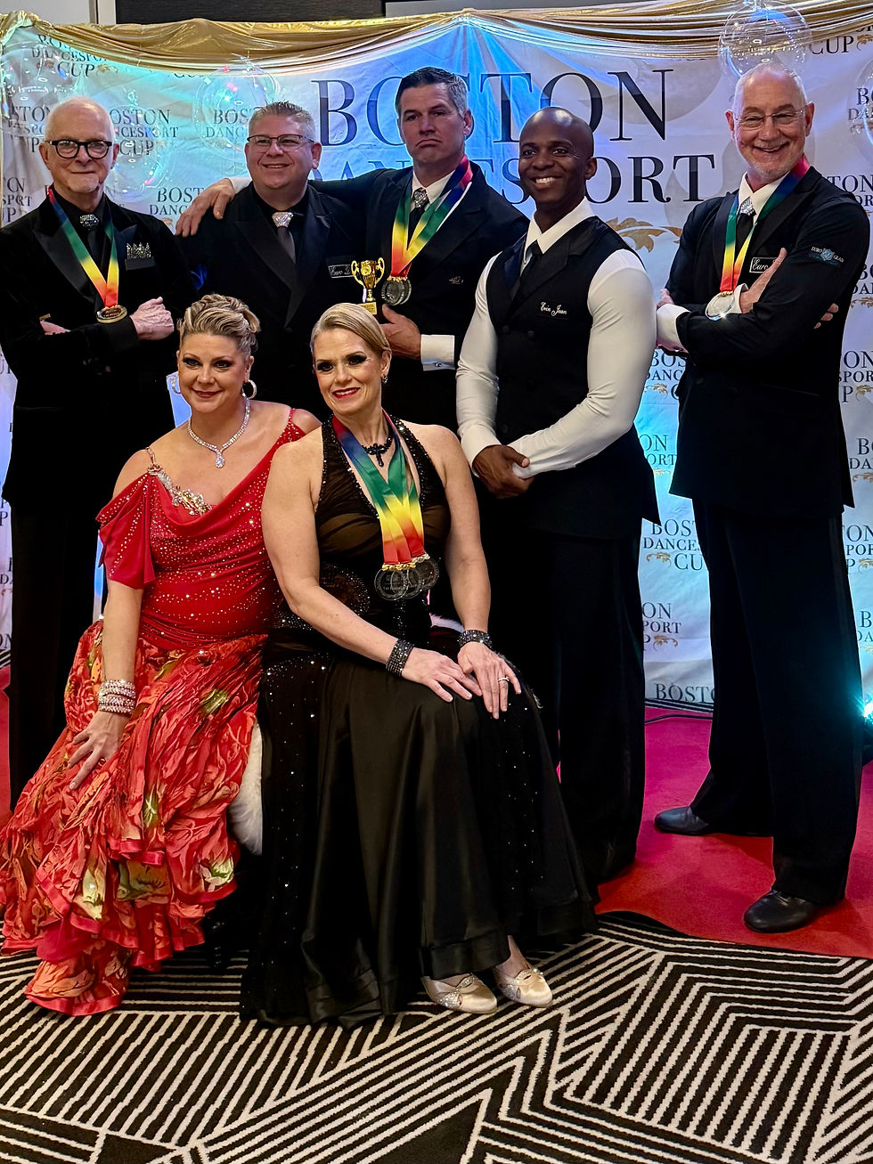 Close-up view of a dance instructor demonstrating a step to a student in a bright studio