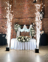 A Sweetheart's Table is set up with cold sparks on each side at SGV Event Center, #1 among wedding venues in san gabriel valley.
