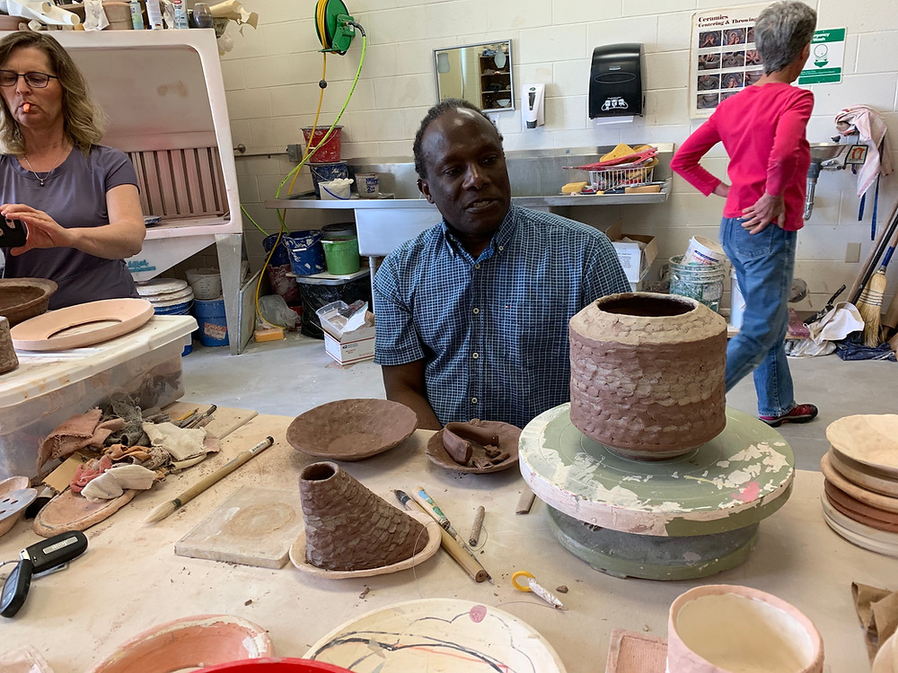 Sam with completed demo pieces.