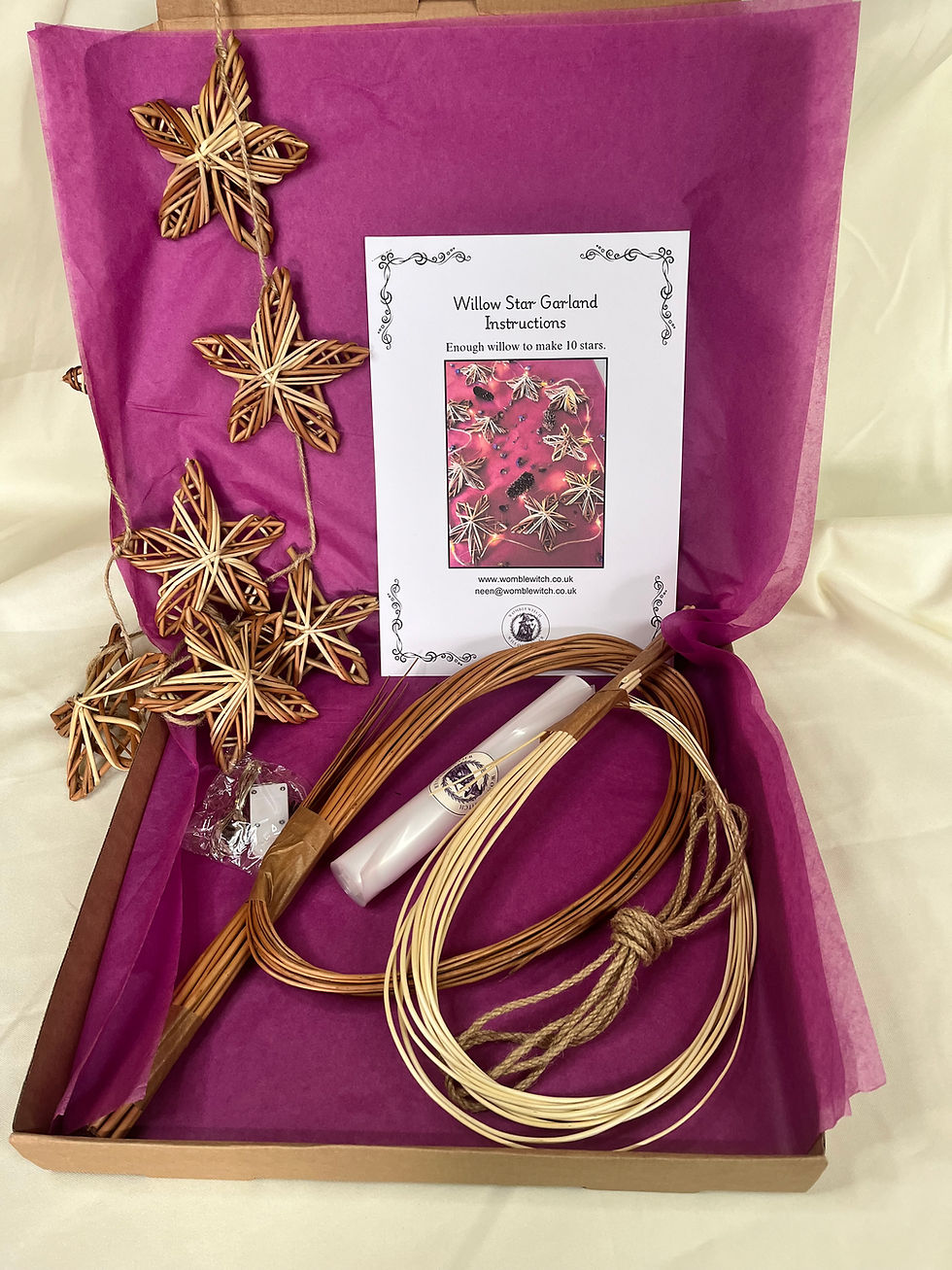 An open box displaying pink a Star garland willow craft kit