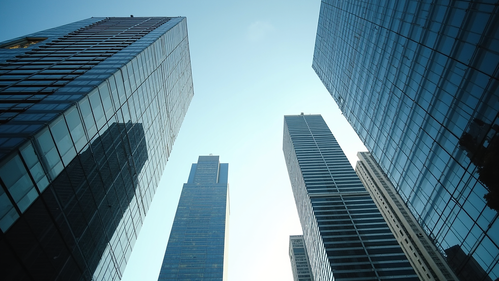 Eye-level view of a Canadian city skyline with office buildings and clear sky