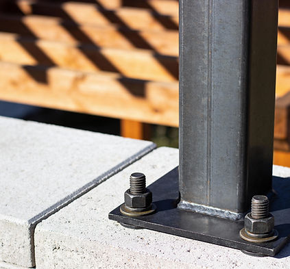 Steel post attached to concrete for durability