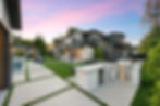 Modern backyard with outdoor kitchen swimming pool lounge area at sunset