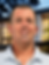 Headshot of real estate agent, modern home background