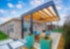 Modern pergola patio design with seating area