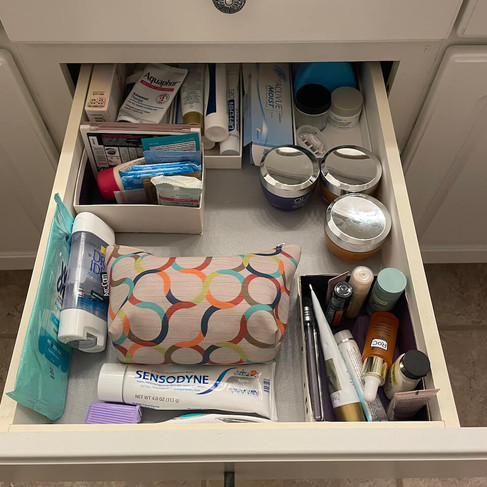 bathroom drawer clutter contained in repurposed boxes