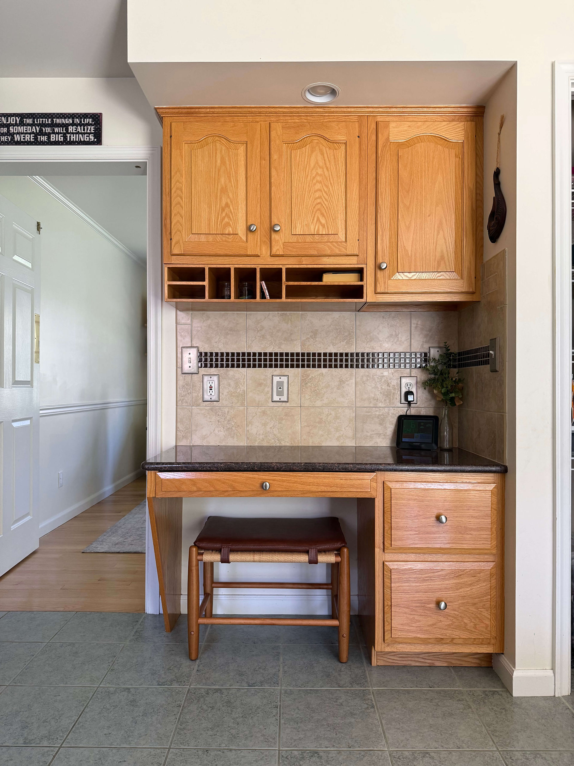 built-in desk with upper oak cabinets