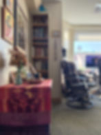 side view of altar with devotional decor and art hung above