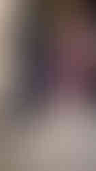 boxes of sentimental items hidden under clothes in closet