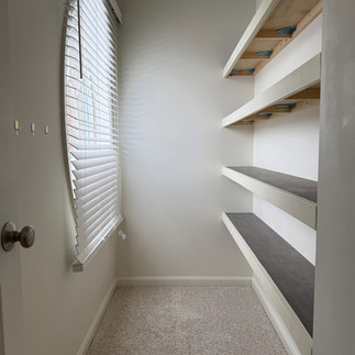 empty shelves in walk-in closet