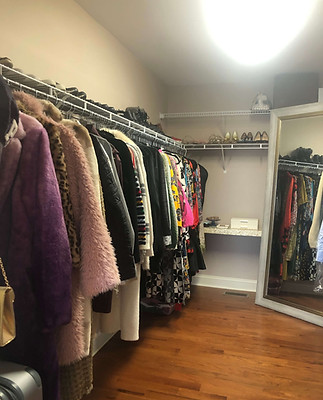 after walk-in wardrobe of neatly hung clothes and organized shoes on shelf