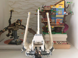 built LEGO space ship and treehouse displayed on shelf