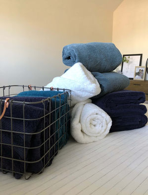 folded towels on bed