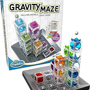 Gravity Maze game box and setup with colorful towers and marble. Text: "Gravity Maze - Falling Marble Logic Game. ThinkFun". Vibrant and playful.