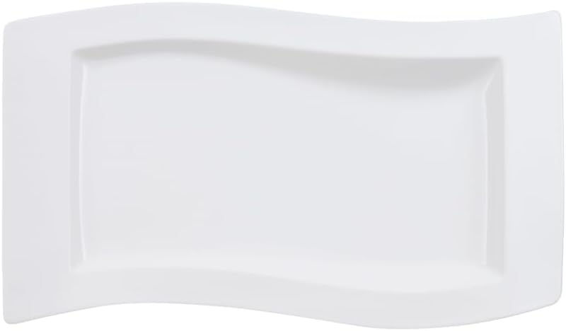 White rectangular wavy-edged serving plate on a white background, minimal and clean.