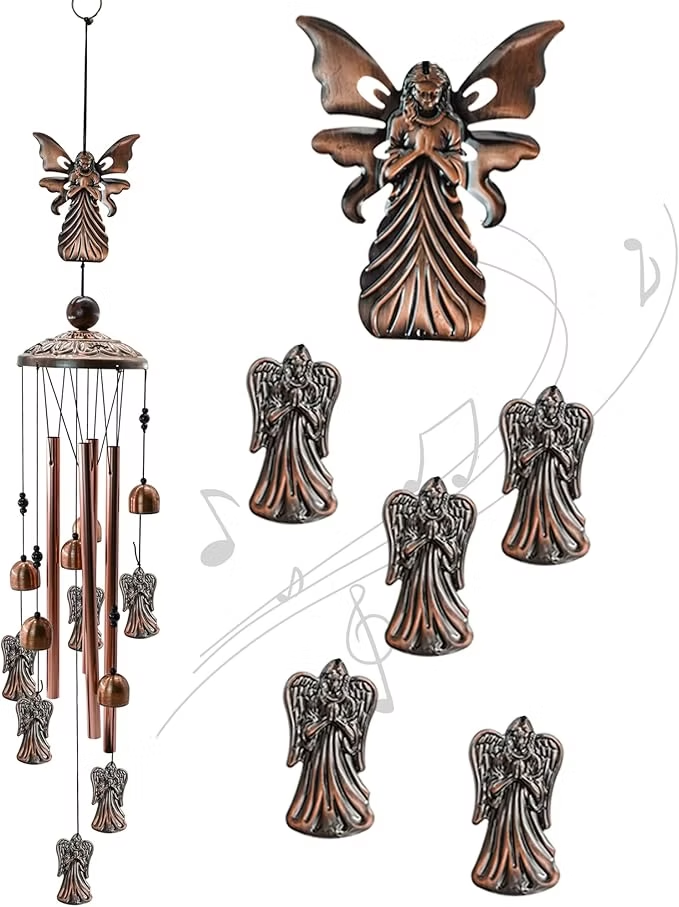 Copper angel wind chime with dangling bells and multiple angel figurines on white background with faint musical notes.
