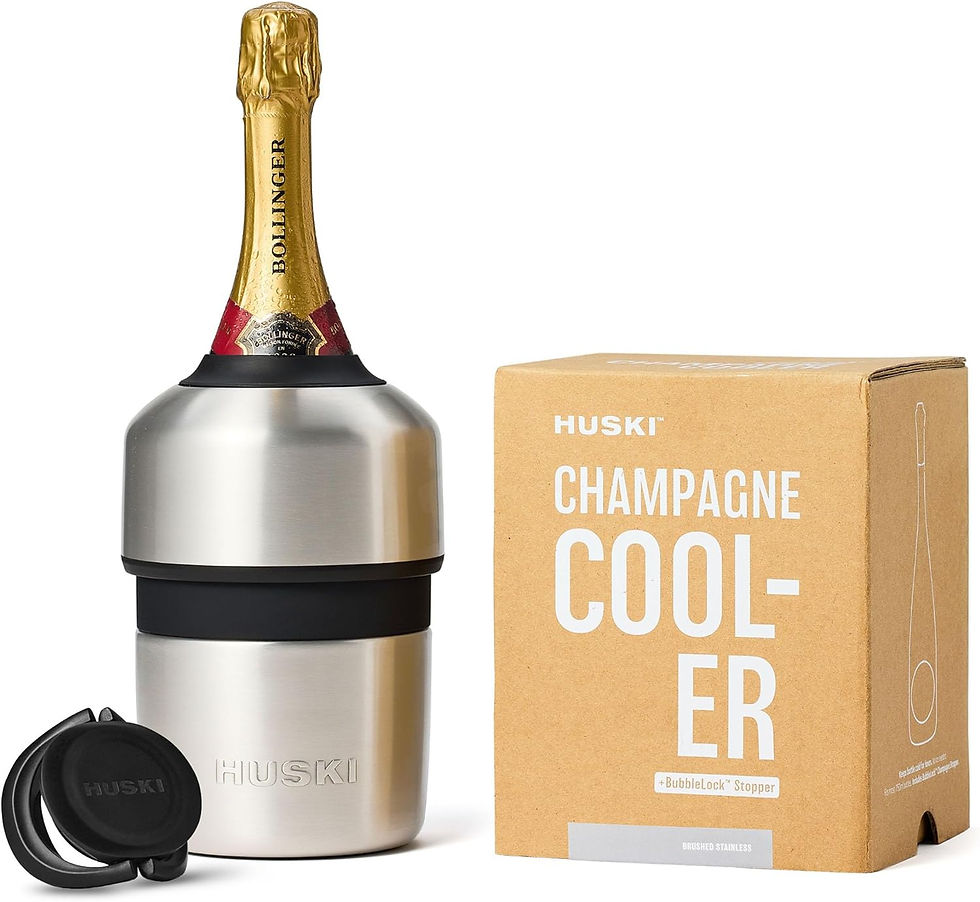 Huski stainless champagne cooler holding a bottle beside its box labeled CHAMPAGNE COOL-ER on white background
