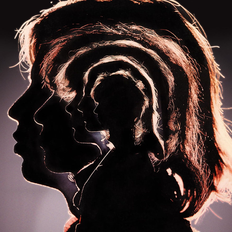 Backlit overlapping side-profile silhouettes of a person, hair glowing copper against a dark background, creating a moody layered effect