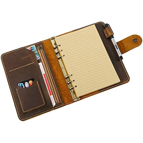 Brown leather notebook with lined paper, pen holder, card slots, and a pocket for documents. Rustic design with visible stitching.