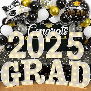 Lit "2025 GRAD" letters, surrounded by black, white, and gold balloons with "Congrats" banners, creating a celebratory graduation vibe.