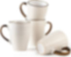 Four white textured mugs with gold handles, one tipped on its side, arranged on a white studio background.