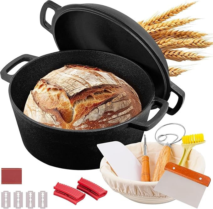 A cast iron pot with a crusty bread loaf, wheat stalks, and bread-making tools including a whisk, scraper, and scoring blades on a white background.